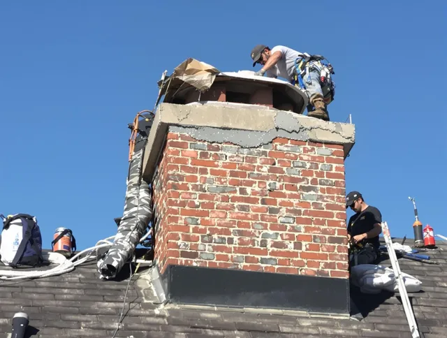 Weston Chimney Sweep installing a custom chimney crown in Weston, CT