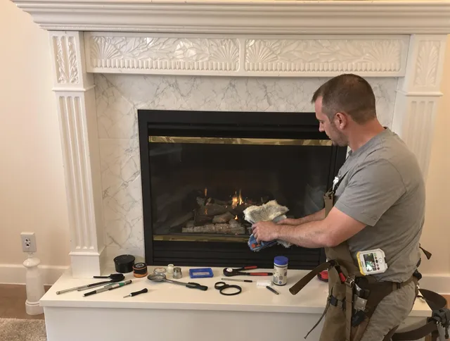 Weston Chimney Sweep performing fireplace maintenance in Weston, CT