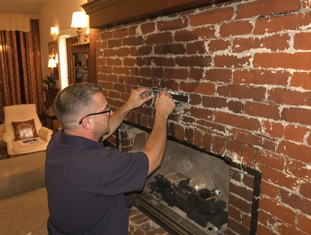 Weston Chimney Sweep expert fixing a fireplace in Weston, CT
